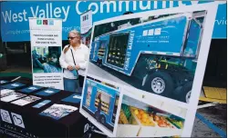  ?? RANDY VAZQUEZ — STAFF PHOTOGRAPH­ER ?? Client Gayelynn Miller attends the unveiling of the temporary West Valley Community Services facility at The Oaks shopping center in Cupertino on Sept. 16.