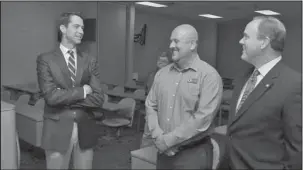  ?? The Sentinel-Record/Richard Rasmussen ?? MEET THE FACULTY: From left, U.S. Sen. Tom Cotton speaks with Lakeside School District Superinten­dent Sean Cook and state Rep. Les Warren, R-District 25, prior to addressing students in Lakeside High School’s auditorium Friday morning.