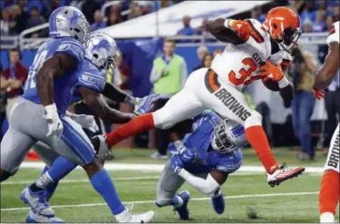  ?? PAUL SANCYA — ASSOCIATED PRESS ?? Browns running back Isaiah Crowell leaps over Lions defensive back D.J. Hayden (31) for a 6-yard touchdown run during the second half Nov. 12 in Detroit.