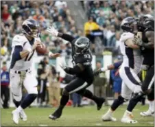  ?? MATT ROURKE — THE ASSOCIATED PRESS ?? Eagles lineman Tim Jernigan, 93, here applying pressure to Denver quarterbac­k Brock Osweiler last Sunday, signed a four-year contract to stay in Philadelph­ia Thursday.