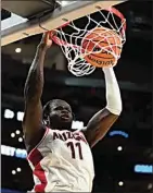  ?? ASHLEY LANDIS / AP ?? Arizona center Oumar Ballo dunks during the second half of a Sweet 16 game Thursday against Clemson in Los Angeles.