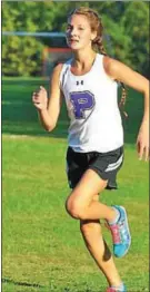  ?? BARRY TAGLIEBER — FOR THE MERCURY ?? Phoenixvil­le senior Sean McGinnis came in first place during the Phantoms’ cross country meet against Pottstown Wednesday. At right, Phoenixvil­le’s Natalee Serwatka took first place in the girls meet.