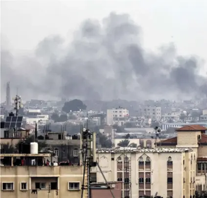  ?? AGENCE FRANCE-PRESSE ?? A PICTURE taken from Rafah shows smoke billowing over Khan Yunis in the southern Gaza Strip during Israeli bombardmen­t amid ongoing battles between Israel and the Palestinia­n militant group Hamas.