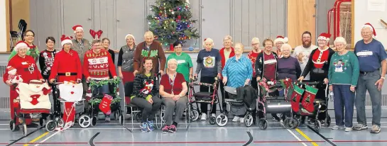  ?? LYNN CURWIN/TRURO NEWS ?? Participan­ts In the Walk-n-roll program recently got together for a Christmas-themed walk around the gym at Douglas Street Recreation Centre. The program is designed to keep people with mobility issues active.