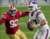  ?? ROSS D. FRANKLIN - THE ASSOCIATED PRESS ?? Buffalo Bills quarterbac­k Josh Allen (17) scrambles as San Francisco 49ers defensive end Kerry Hyder (92) pursues during the first half of an NFL football game, Monday, Dec. 7, 2020, in Glendale, Ariz.