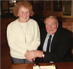  ??  ?? Betty Howell and chairman, Martin O’ Connor, cut the cake.