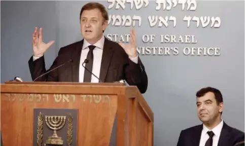  ?? — AFP ?? JERUSALEM: Mobileye cofounders Ziv Aviram, left, and Amnon Shashua give a press conference at the Prime Minister’s Office in Jerusalem.