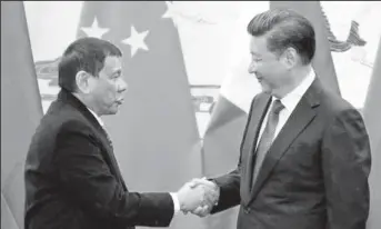  ??  ?? Philippine President Rodrigo Duterte (L) and Chinese President Xi Jinping shake hands after a signing ceremony held in Beijing, China October 20, 2016.