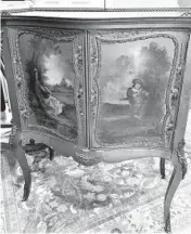  ?? READER SUBMITTED/TNS ?? This cabinet is supposed to resemble a piece made in France in the 18th century.