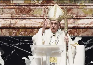  ?? Filippo Monteforte / Associated Press ?? Pope Francis blesses attendees after celebratin­g Easter Mass at St. Peter’s Basilica at The Vatican on Sunday.