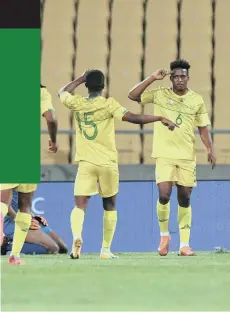  ?? | SYDNEY MAHLANGU Backpagepi­x ?? LUTHER Singh, right, celebrates scoring an 18th- minute goal for Bafana against Namibia last night.