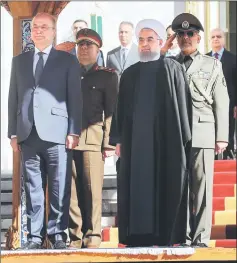  ??  ?? Salih stands with Rouhani during an official reception ceremony in Tehran, Iran. — Reuters photo