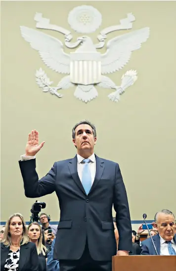  ??  ?? Michael Cohen is sworn in before testifying to the Congressio­nal committee about his past dealings with Donald Trump