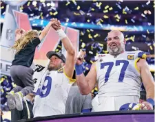  ?? MARCIO JOSE SANCHEZ ASSOCIATED PRESS ?? Rams quarterbac­k Matthew Stafford, left, pulls up one of his daughters on stage while celebratin­g with offensive tackle Andrew Whitworth after the Super Bowl on Sunday in Inglewood, Calif.