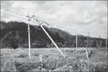  ?? ERIKA P. RODRIGUEZ / THE NEW YORK TIMES ?? Power lines damaged by Hurricane Maria are seen Nov. 4 near Vega Baja, Puerto Rico.