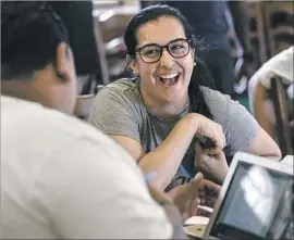  ?? Mark Boster Los Angeles Times ?? MAYRA RAMIREZ, a military veteran, jokes with other Warrior-Scholar Project fellows during the weeklong intensive program hosted at USC.