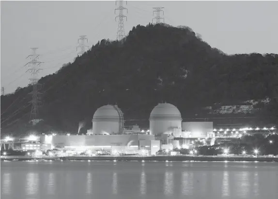  ?? TOMOHIRO OHSUMI / BLOOMBERG NEWS ?? The No. 3, left, and No. 4, reactors at Kansai Electric Power Co.’s Takahama nuclear power station in Takahama Town, Fukui Prefecture, Japan: Since the Fukushima nuclear disaster in March 2011, uranium has been off investors’ radar, but the market...