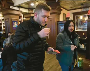  ?? AMY SHORTELL/THE MORNING CALL PHOTOS ?? LEFT: Dakota Wilston, left, and Alyssa Rodriguez sample Shanagary Squash soup Saturday at McCarthy’s Red Stag Pub during the Soup Saunter in Bethlehem.