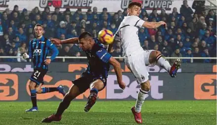  ?? EPA PIC ?? AC Milan’s Krzysztof Piatek (right) scores against Atalanta in Bergamo on Saturday.