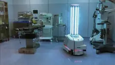  ?? UVD Robots via © The New York Times Co. ?? The ultraviole­t C light emitted by the robot, right, kills DNA in the coronaviru­s.