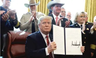  ?? EVAN VUCCI/AP ?? President Donald Trump issued the first veto of his presidency on Friday, overruling Congress to protect his emergency declaratio­n for border wall funding.