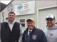  ?? PAUL POST — DIGITAL FIRST MEDIA ?? State agricultur­e Commission­er Richard Ball, center, congratula­tes Dan Richards, left, and Kyle Depew, right, on the opening of their new Bunker Hill Organic Creamery, located at Richview Farms in Cossayuna, Washington County.