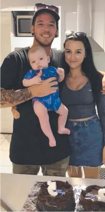  ??  ?? Parents Josh Gall and Jess Pisarek with their baby son Lucas, who died unexpected­ly on Monday aged just four months.