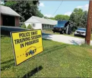  ?? DAN SOKIL - DIGITAL FIRST MEDIA ?? Signs posted on the front yard of three vacant houses on the 2000 block of Orvilla Road in Hatfield Township announce training exercises by the Montgomery County SWAT Team - Central Region on Wednesday.