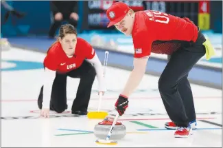  ?? NATACHA PISARENKO / AP ?? American Matt Hamilton sweeps the ice as his teammate and sister Becca watches during a mixed doubles curling match Thursday at the 2018 Winter Olympics. Matt Hamilton use the Smartbroom in his training.