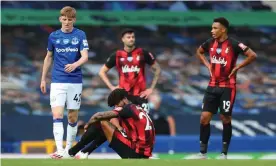  ??  ?? Bournemout­h players reflect on relegation from the Premier League after the final whistle of their 3-1 win against Everton at Goodison Park. Photograph: Catherine Ivill/Reuters