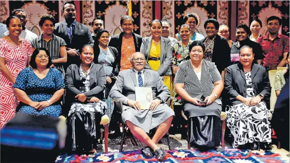  ?? Picture: JONA KONATACI ?? Staff members of the Ministry of Health with Prime Minister Sitiveni Rabuka during the launch of the National Policy on Healthy Catering for Government Ministries at Suva Civic Centre yesterday.