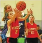  ?? BARRY TAGLIEBER - FOR DIGITAL FIRST MEDIA ?? Comets’ Heaven Steytler and Monarchs’ Devon McAleer go for the rebound during their PMYC Big Sisters game.