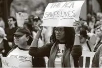  ?? Stephen Spillman / Contributo­r ?? Taelor Faulkner, left, and Love Kelly, both of Arlington, join the Cover Texas Now! rally at the Texas Capitol in 2017.