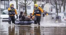  ??  ?? Emergency crews help evacuate residents, Wednesday in Elkhart, Ind. Crews are using boats to help northern Indiana residents amid flooding from melting snow and heavy rain moving across the Midwest. BECKY MALEWITZ /SOUTH BEND TRIBUNE VIA AP