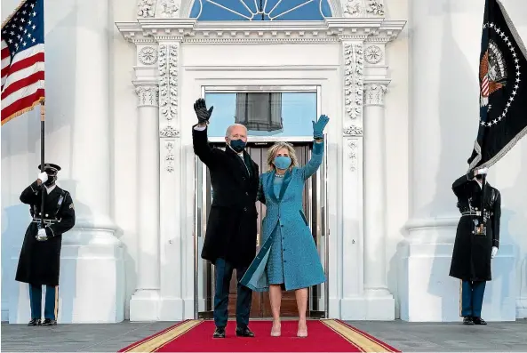  ?? GETTY IMAGES ?? President Joe Biden and First Lady Dr Jill Biden wave as they arrive at the North Portico of the White House.