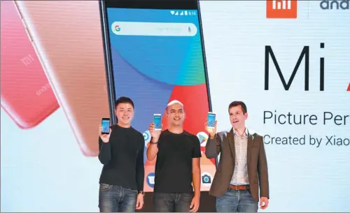  ?? AFP ?? (Left to right): Donovan Sung, director of product management and marketing of Xiaomi Global; Manu Jain, managing director of Xiaomi India; and Jon Gold, global director of Android Partner Programs, launch the Mi A1, Xiaomi’s flagship, dual-camera...