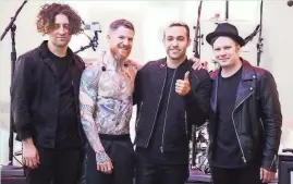  ?? STEPHEN LOVEKIN/GETTY IMAGES ?? Pop rock band Fall Out Boy, featuring (from left) Joe Trohman, Menomonee Falls native Andy Hurley, Pete Wentz and Patrick Stump, is shown in a 2018 photo.