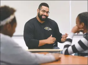  ?? (File Photo/AP/Steve Ruark) ?? Urschel teaches a lesson at Dundalk High School to launch the Texas Instrument­s program in Baltimore in July 2017.