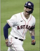  ?? The Galveston County Daily News via AP photo ?? of the Astros yells toward his dugout after hitting a go-ahead home run in the seventh inning Friday.