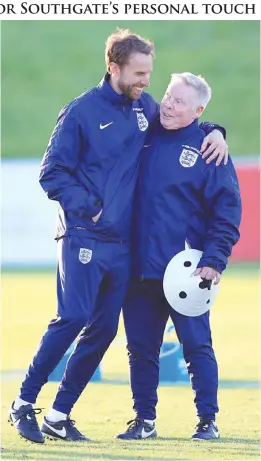  ??  ?? BURTON: England soccer caretaker manager Gareth Southgate, left, with assistant Sammy Lee, during a training session at St George’s Park, Burton, England, Tuesday. England play a Group F World Cup qualifying match versus Malta on Saturday. — AP