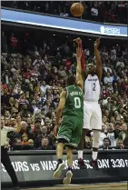  ?? Photo by Tom L. Sandys / The Washington Post ?? John Wall (2) and the Washington Wizards only made two 3-pointers in the first three quarters of Friday night’s Game 6, but they made three in the final quarter of a 92-91 win.