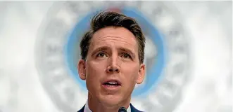  ?? AP ?? Senator Josh Hawley and his friends believe the USA is a Christian nation, and seem sympatheti­c with those who would subvert the law to preserve it in the guise of Trump’s policies.