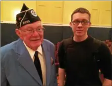  ??  ?? Korean War veteran Bill Reid of Rock City Falls visits with Fort Edward High School student Nathaniel Galusha.