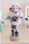  ??  ?? The Hopi Kachina doll depicts a dancing character called Hon the White Bear and stands about 15 centimetre­s tall. It represents healing.