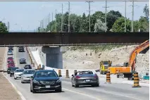  ?? ERROL McGIHON ?? Two lanes of Greenbank Road that run beneath the Via Rail overpass opened to traffic on Friday. Two additional lanes will open later in the year. A pathway on the west aide has also opened.