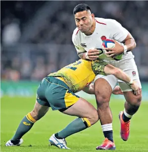  ??  ?? Major threat: England’s Manu Tuilagi (right) made an impact as a replacemen­t against Australia and showed that coach Eddie Jones (left) has a great variety of carriers