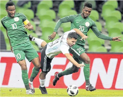  ??  ?? Sergio Aguero, centre, plays for Argentina in a friendly against Nigeria on Tuesday.