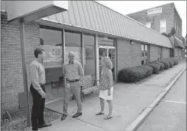  ??  ?? The Conways and Belangia discuss plans for the health clinic and pharmacy they will soon open.