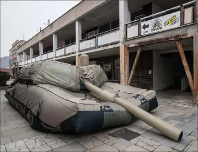  ?? Michal Cizek/AFP via Getty Images ?? Inflatech, a Czech company producing inflatable weapon decoys, such as a decoy of an M1 Abrams tank, above, has seen profits soar since the Russian invasion of Ukraine started last year, its officials said Monday. Inflatech, founded eight years ago and based in the northern Czech city of Decin, makes more than 30 types of inflatable weapons.