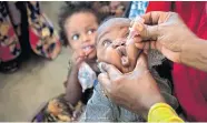  ?? [BEN CURTIS/ASSOCIATED PRESS FILE PHOTO] ?? A Somali baby receives a polio vaccine April 24 at the Medina Maternal Child Health center in Mogadishu, Somalia.